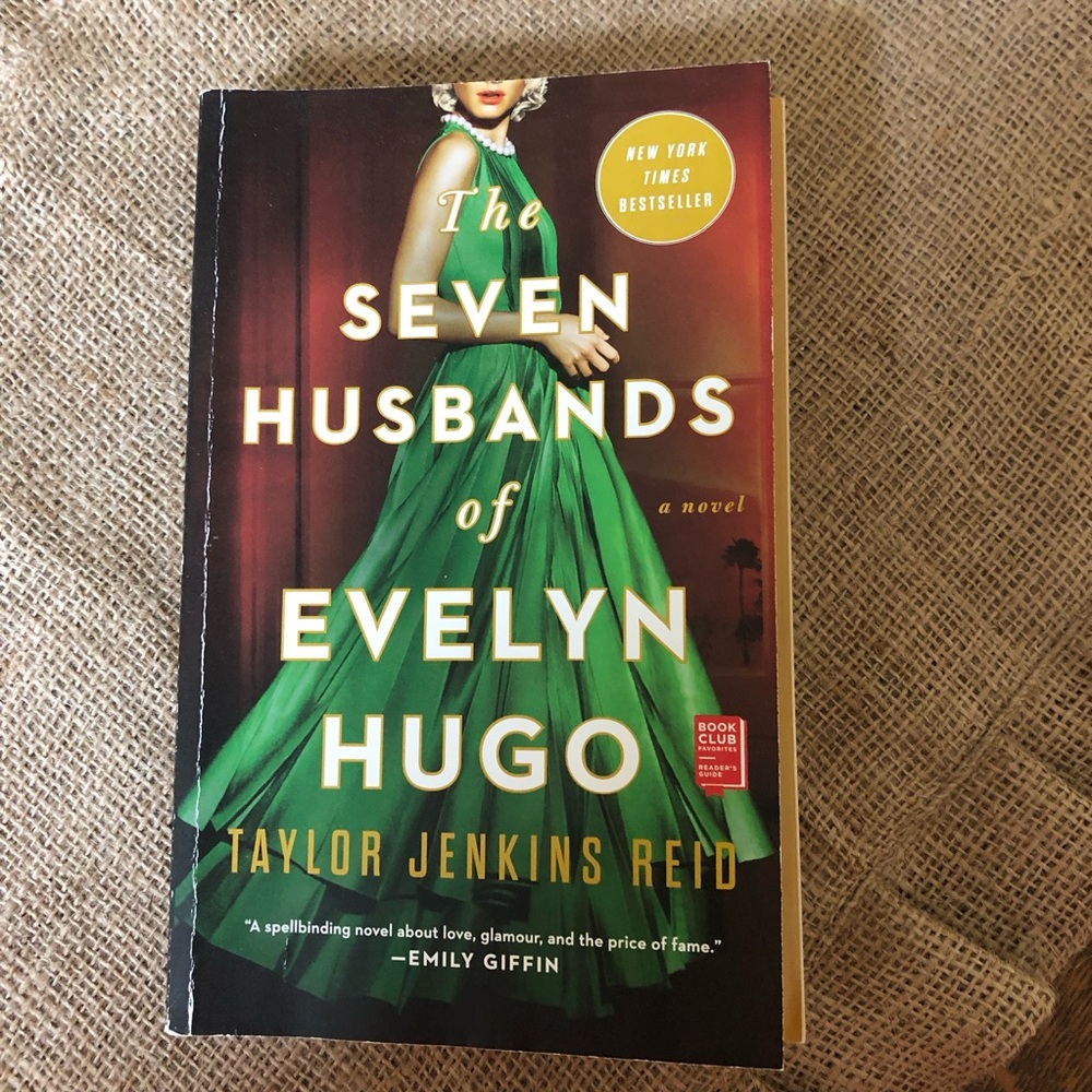 The Seven Husbands of Evelyn Hugo, a paperback book by Taylor Jenkins Reid 📚
